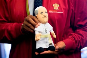 Philadelphia Mayor Michael Nutter displays a Pope Francis doll during a news conference, Monday, June 1, 2015, in Philadelphia. Aramark has been named the official retail provider of event merchandise for the scheduled Eighth World Meeting of Families Congress and Papal Visit to Philadelphia in September. (AP Photo/Matt Rourke)