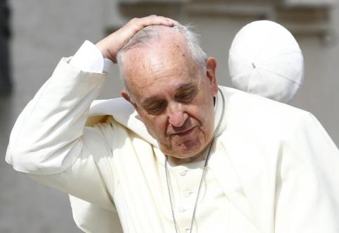 A gust of wind blows away Pope Francis' zucchetto as he arrives to lead his weekly general audience in St. Peter's Square at the Vatican June 24. (CNS photo/Tony Gentile, Reuters) See POPE-AUDIENCE June 24, 2015.
