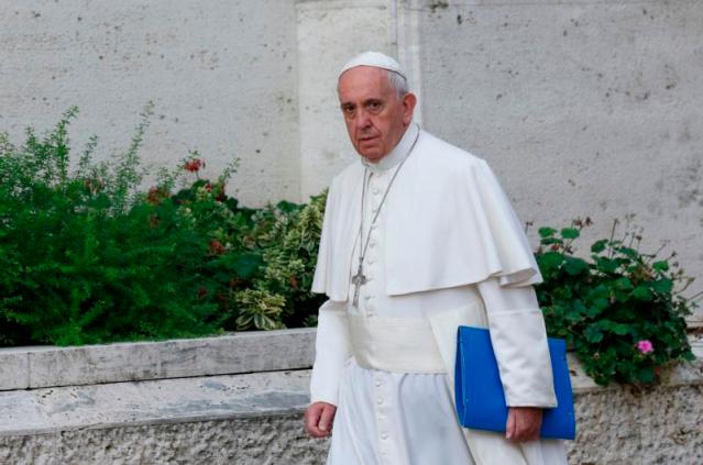 Pope Francis arrives for morning session of Synod of Bishops on the family at Vatican
