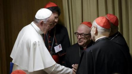 Pope Francis talks with cardinals as he leads the synod on the family in the Synod hall at the Vatican, October 5, 2015. REUTERS/Max Rossi