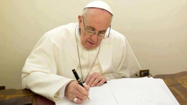 Pope-Francis-writing-740x493