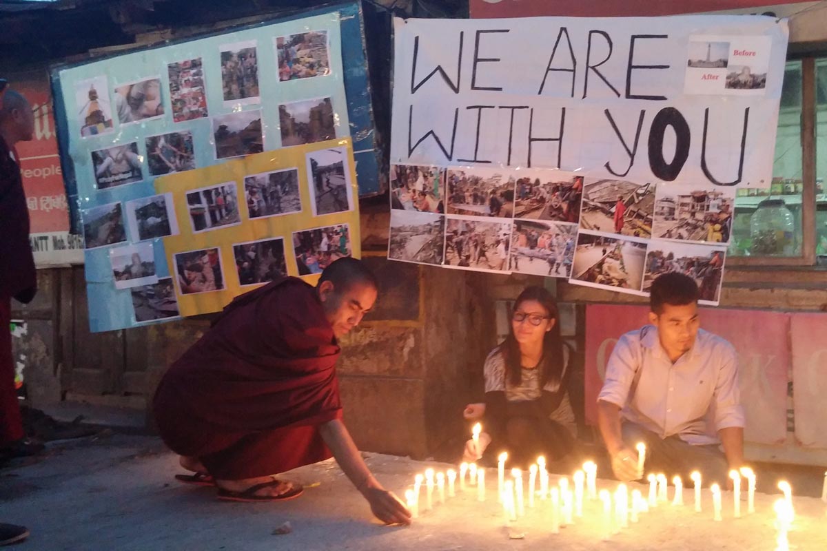 Exile Tibetans light candles during a solidarity gathering for the victims of the Nepal earthquake, in McLeod Ganj, India, on 26 April 2015.